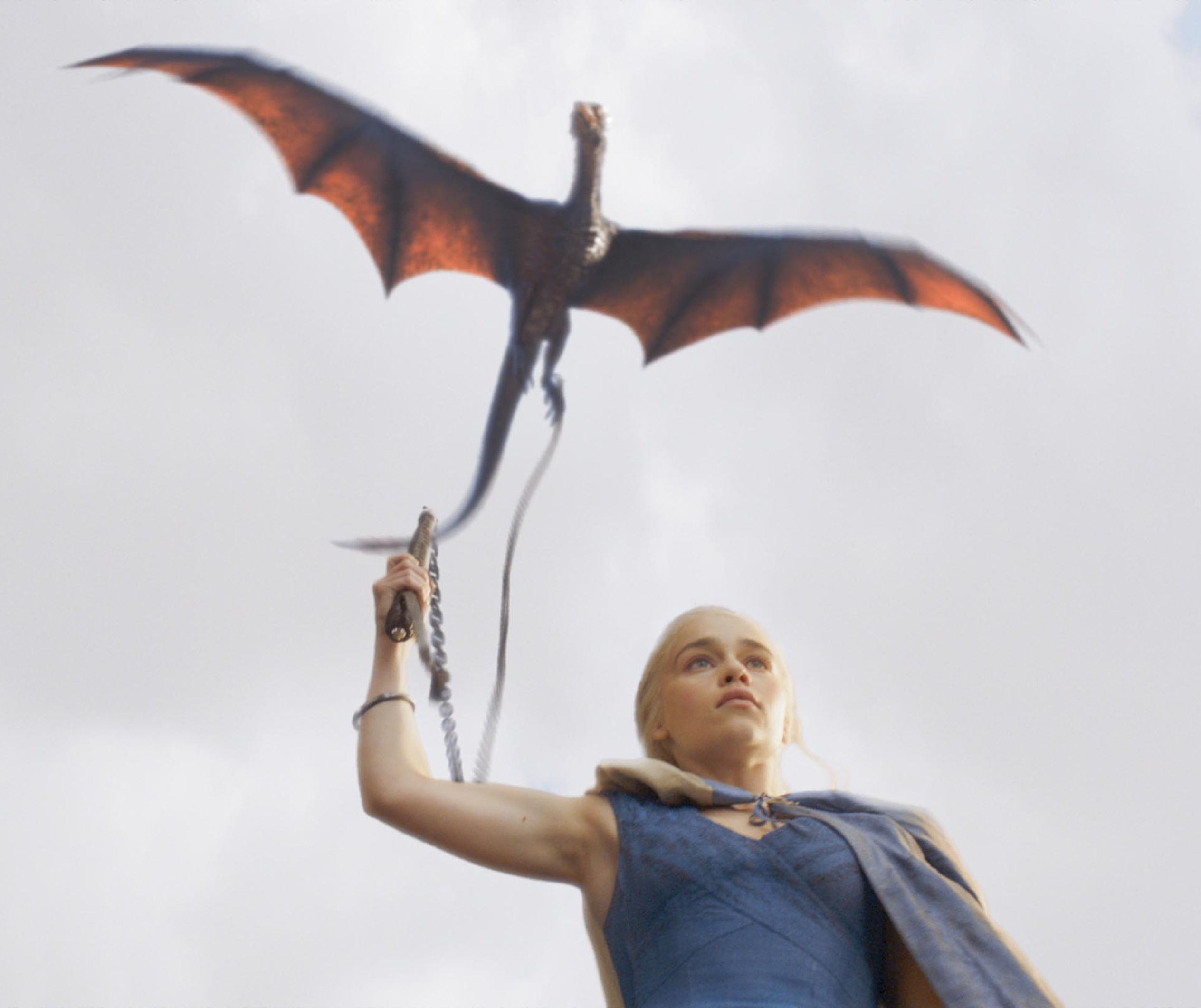 The Game of Thrones character Daenerys Targaryen controls her dragon, Drogon.